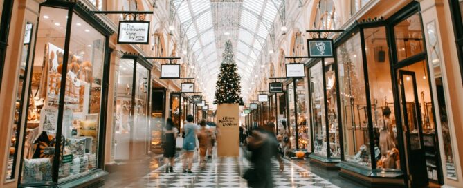 Image of shopping mall with shoppers moving about